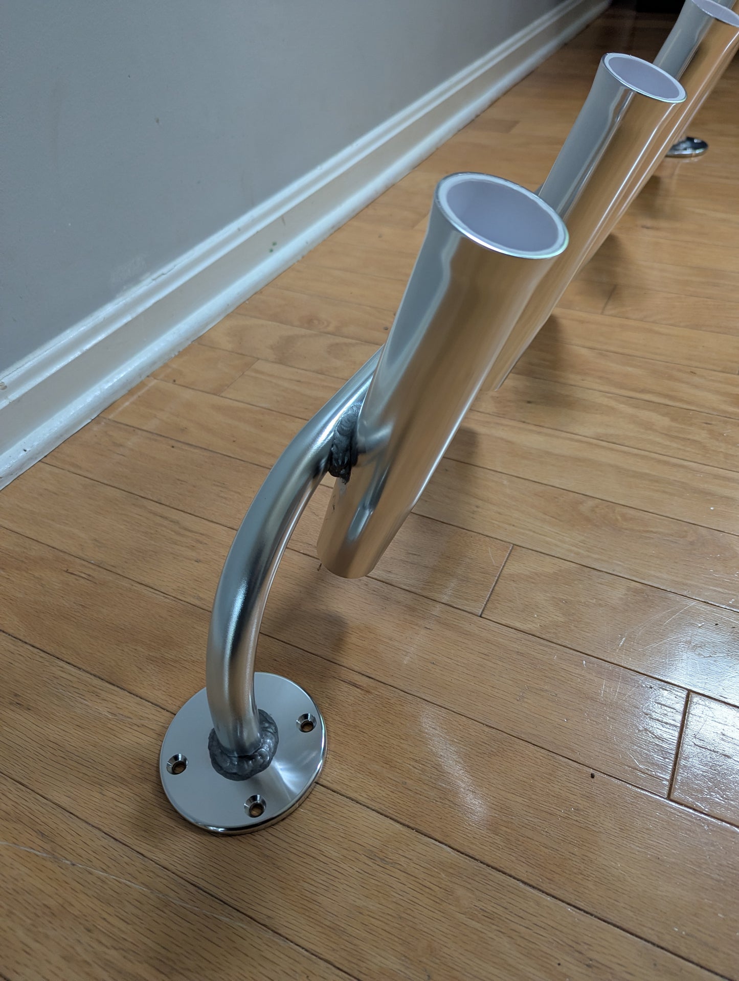 Polished anodized fishing rod racks